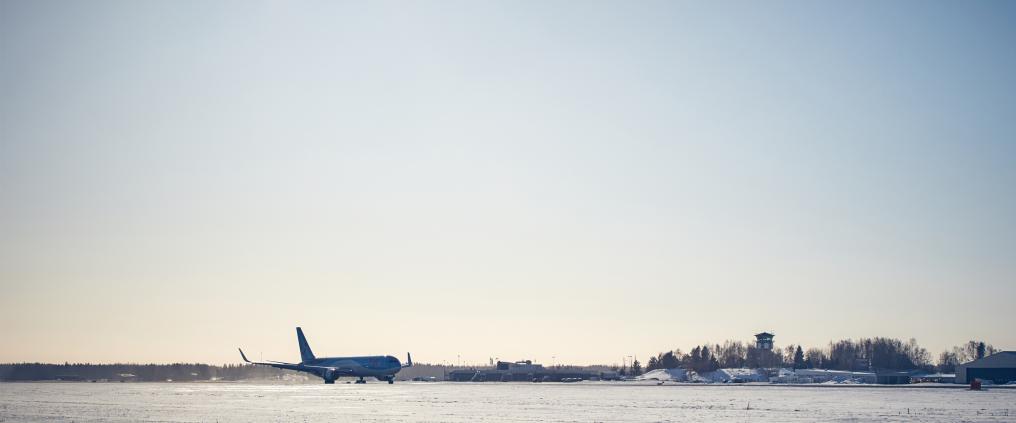 Plane at wintery airport.