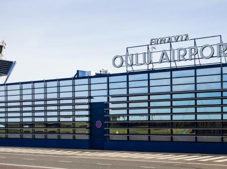 Oulun airport's reflective glass facade.