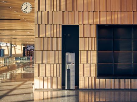 Water automat and 3D wood panel wall.