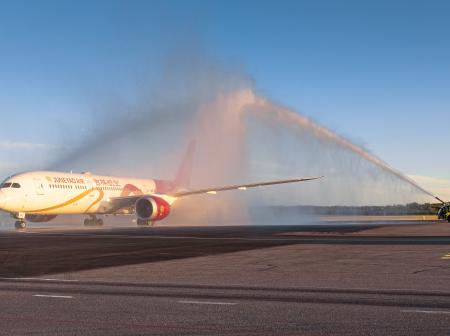 Juneyao airplane getting a water salute.