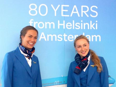 KLM airline staff posing for pictures at KLM 80 years celebration event.