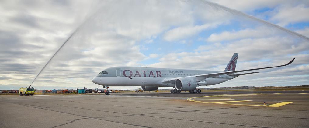 Qatar airplane receiving a water salute.